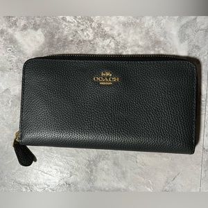 Coach slim zip around long wallet in navy blue.